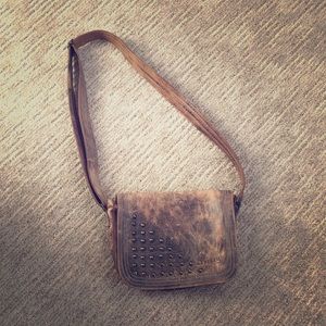 Leather crossbody bag with adjustable strap.